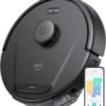 Eufy Robot Vacuum with a slim, round black design, gliding across a carpeted floor in a minimalist living room. The vacuum is shown detecting and cleaning around furniture, emphasizing its quiet operation, powerful suction, and self-charging feature.