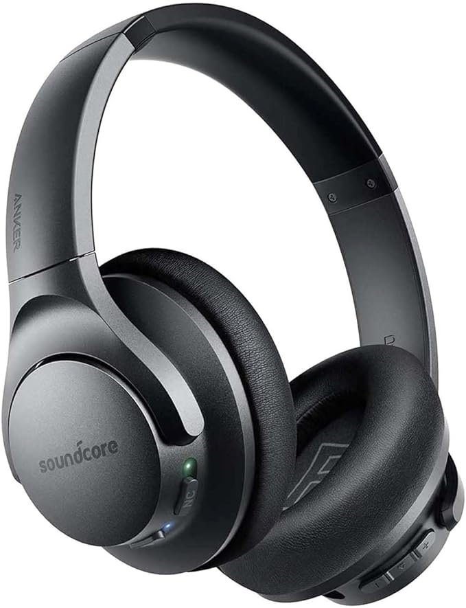 Anker Soundcore Life Q20 wireless headphones with a sleek black design, featuring padded ear cups and a comfortable headband. The headphones are displayed in a cozy living room, highlighting their active noise-cancelling technology and Bluetooth connectivity for high-quality audio.