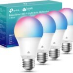 Kasa Smart Light bulb with a modern white design, installed in a contemporary living room lamp, glowing in a warm white tone. The smart bulb highlights its ability to adjust brightness and color temperature, showcasing compatibility with Alexa and Google Assistant for hands-free voice control.